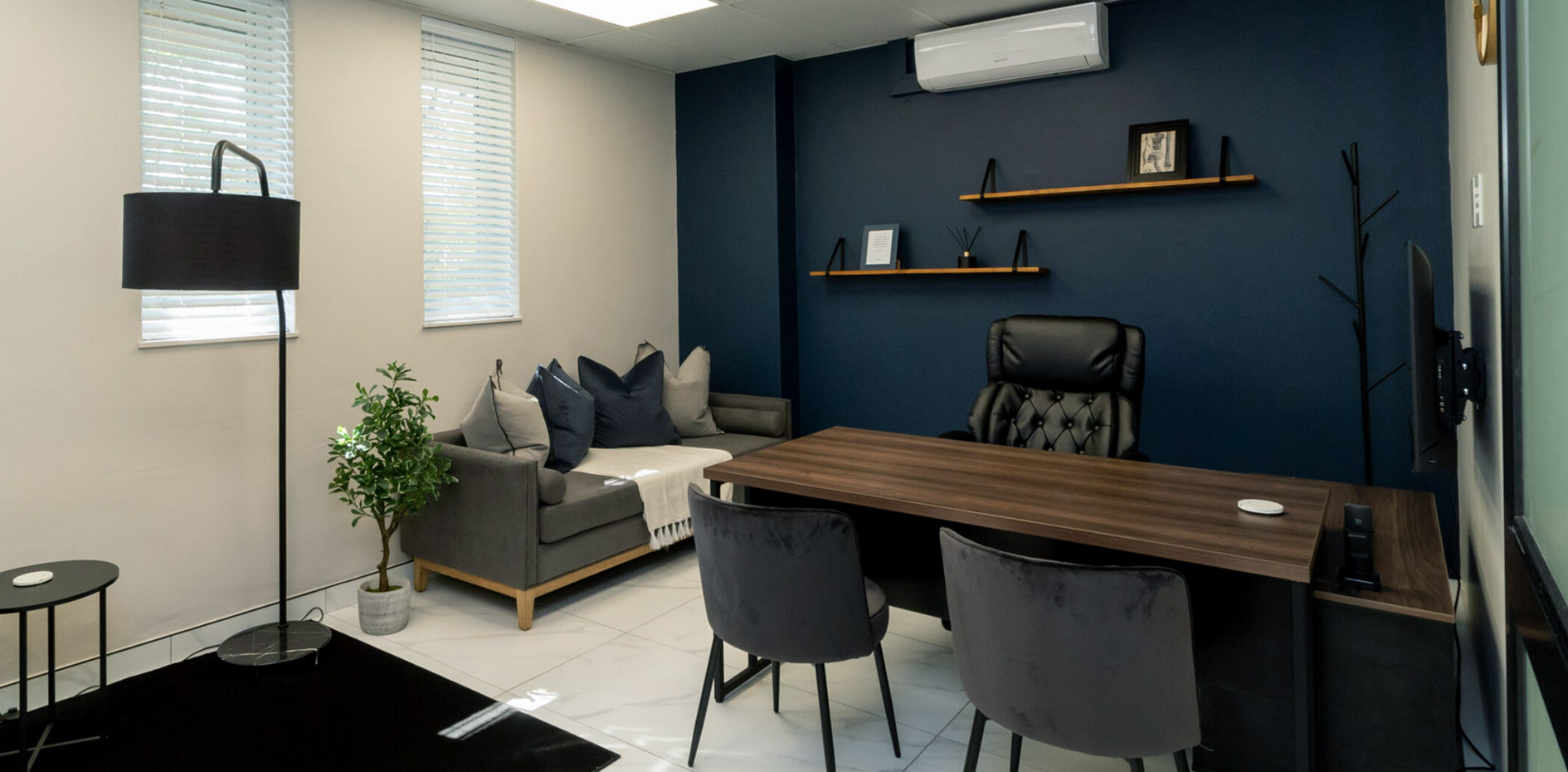 A complete private medical practice interior designed and styled by edge.ids, featuring custom furniture, precise light management, and high-end finishes.