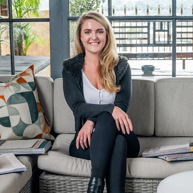 Professional portrait of Sarah Plagis, founder and lead interior designer at edge.ids